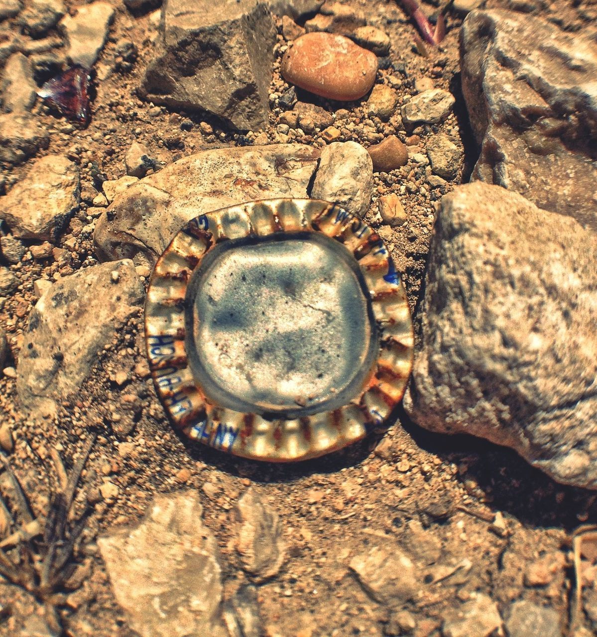 textured, close-up, high angle view, stone - object, rock - object, old, rough, metal, still life, outdoors, no people, pattern, stone, full frame, day, circle, backgrounds, detail, directly above, abandoned