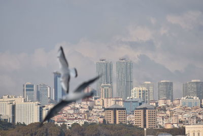 Modern buildings in city against sky