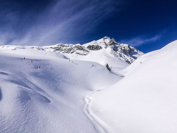 Scenic view of snow covered mountain against sky