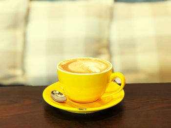 Close-up of coffee cup on table