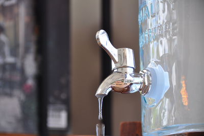 Close-up of faucet in container