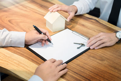 High angle view of man working on table