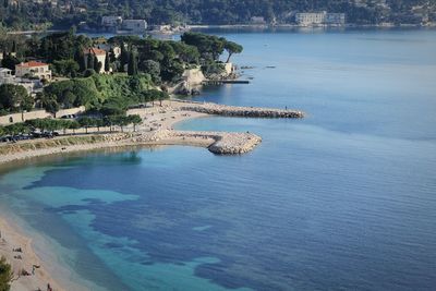 High angle view of sea by trees