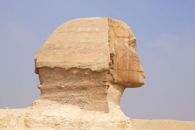 Low angle view of rock formations against clear sky