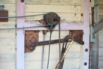 Close-up of rusty pipes on metal door