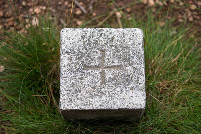 Close-up of cross on field