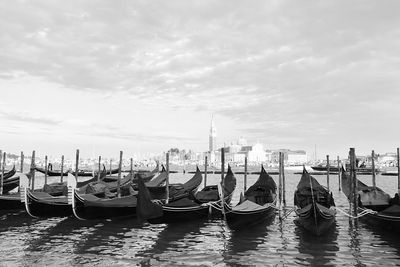 Boats moored at dock