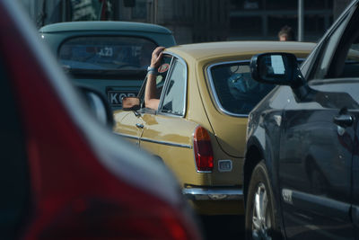 Close-up of vintage car on road