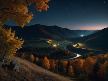 Scenic view of landscape against sky at night