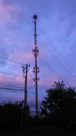 Low angle view of power lines against sky