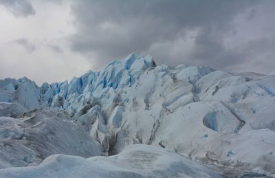 Scenic view of snow covered landscape against sky