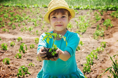 Portrait of girl picking flowers