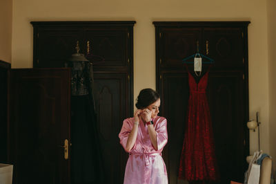 Bride getting dressed for wedding