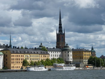 View of buildings against cloudy sky