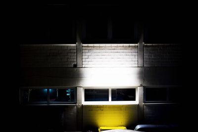 Train on illuminated window at night