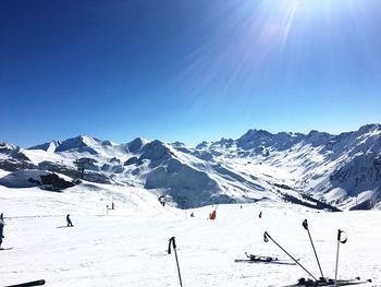 Scenic view of snow covered mountains against sky