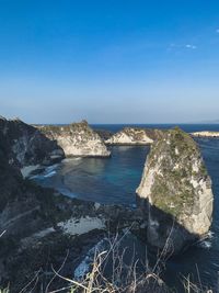 Scenic view of sea against clear blue sky