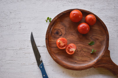 High angle view of cherry tomatoes on cutting board