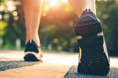 Low section of woman wearing shoes outdoors