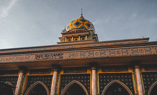 Low angle view of temple building against sky