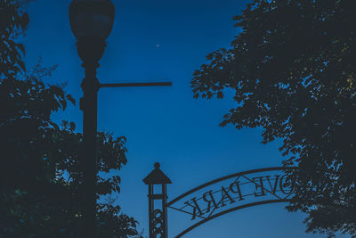 Low angle view of street light against sky