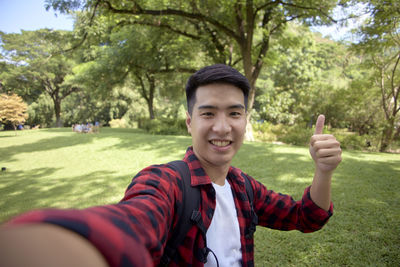 Portrait of smiling boy in park