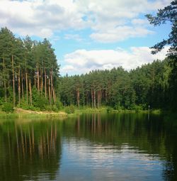 Scenic view of lake against cloudy sky