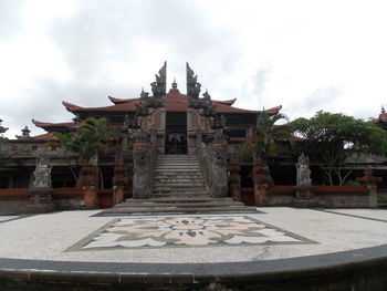 Built structure against cloudy sky