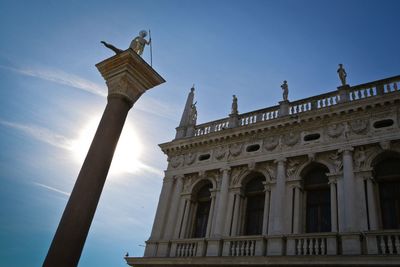 Low angle view of historical building against blue sky