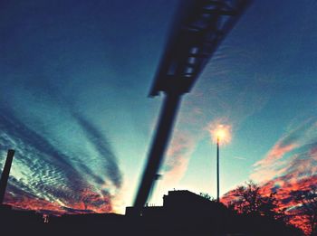 Low angle view of building against sky at sunset