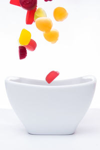 Close-up of strawberry over white background