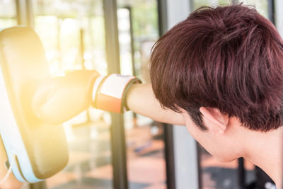 Man practicing boxing on punching bag