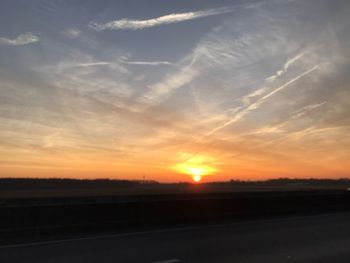 Scenic view of road against sky during sunset