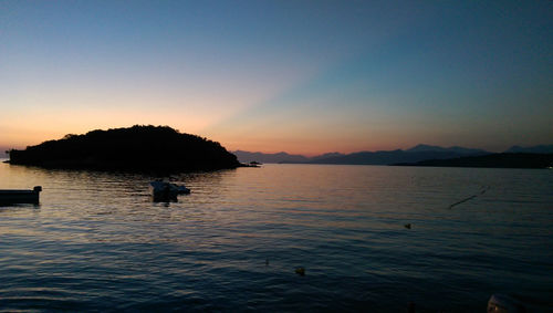 Scenic view of sea against clear sky during sunset