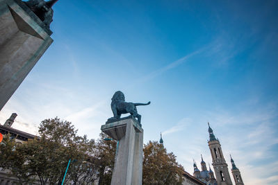 Low angle view of statue against sky