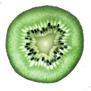 Close-up of fruit slices on white background