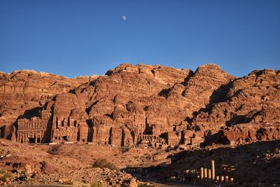 View of rock formations against blue sky