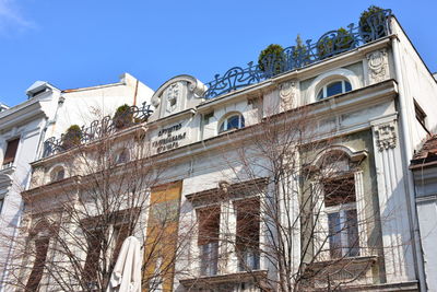 Low angle view of building against clear blue sky