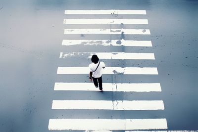 High angle view of pedestrian crossing zebra