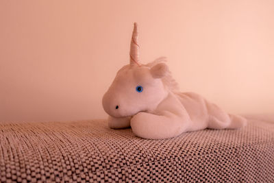 Close-up of stuffed toy on bed