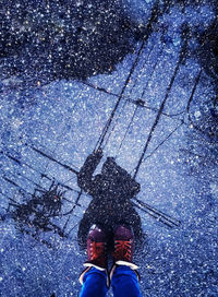 Low section of person standing on street