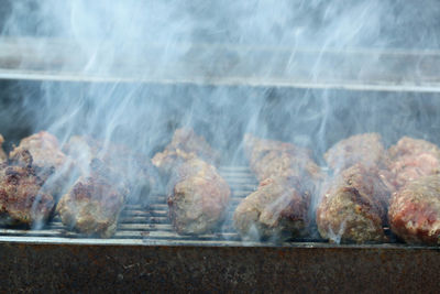 Close-up of meat on barbecue grill