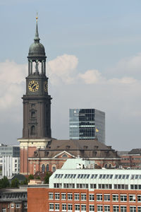 Vertical view of st. michael's church bell tower under the blue sky