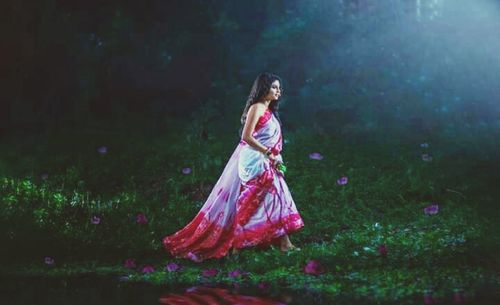 Woman standing on field