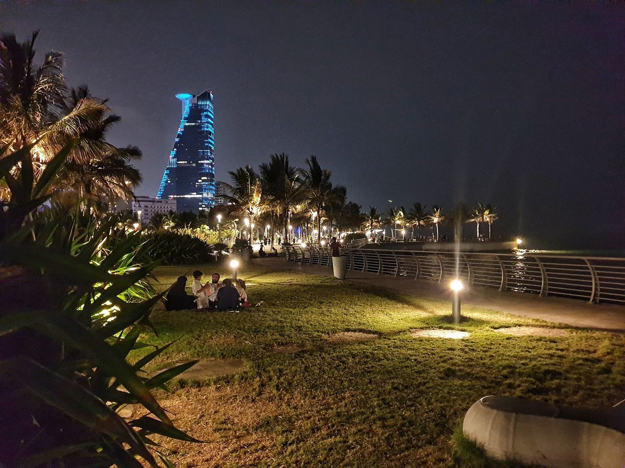 VIEW OF ILLUMINATED CITY AT NIGHT