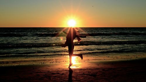 Scenic view of sea at sunset