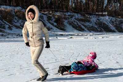 Full length of woman in snow