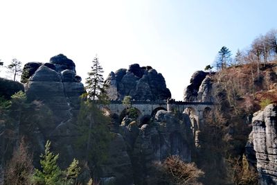 View of rocks on mountain against sky