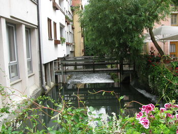 View of canal amidst buildings