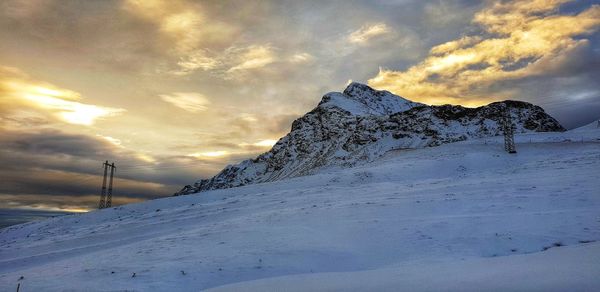 Snow covered mountain against sky